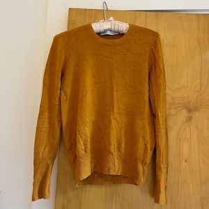 Mustard yellow Zara knit long-sleeved top with gold buttons at the wrist